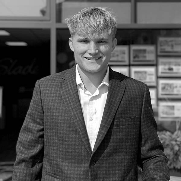 Slades Estate Agents - Lettings Office - Ollie Baker - Jacket B&W